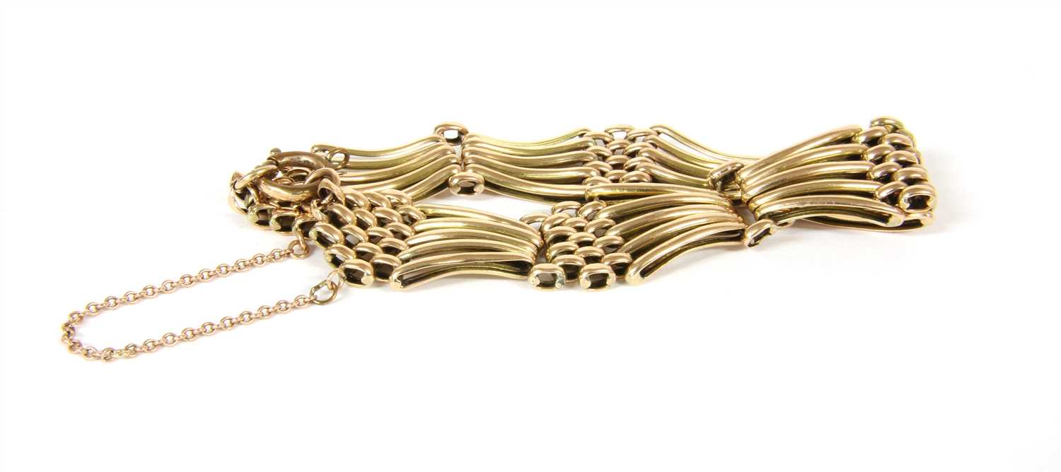 Lot 55 - An Edwardian five row fan shaped gate bracelet