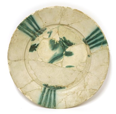 Lot 511 - An Abbasid pottery fragmentary charger
