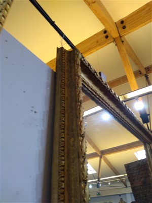 Lot 13 - A large pair of carved and gilded picture frames