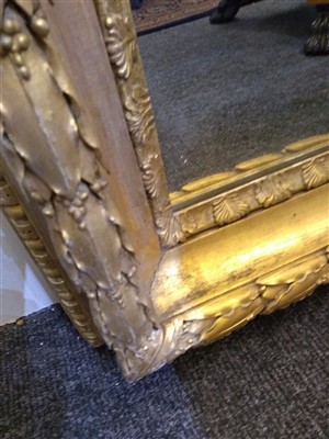 Lot 13 - A large pair of carved and gilded picture frames
