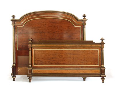 Lot 354 - A late 19th century plum pudding mahogany and gilt heightened double bed