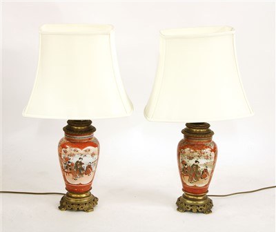 Lot 393 - A pair of Satsuma and gilt metal mounted table lamps
