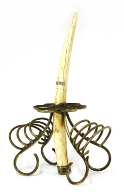 Lot 202 - A walrus tusk and silver-plated mounted egg and toast rack