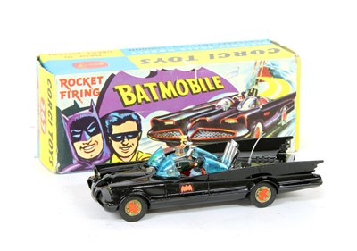 Lot 1168 - A Corgi 267 Batmobile in original box and display stand