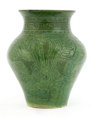 Lot 6 - A green-glazed pottery vase