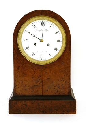 Lot 24 - A French amboyna mantel clock