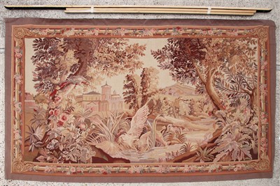 Lot 261A - A tapestry depicting a lion attacking a bird