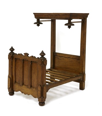 Lot 696 - A miniature oak tester bed