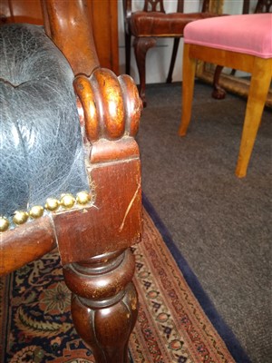 Lot 143 - A pair of mahogany library armchairs