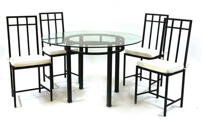 Lot 480 - A Tom Faulkner wrought iron glass topped dining table and four chairs