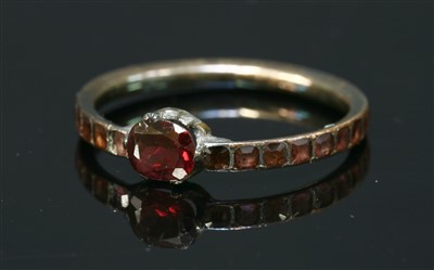 Lot 25 - A Georgian gold flat cut garnet ring