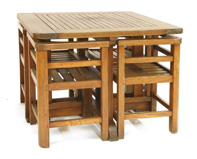 Lot 111 - An Heal's teak garden table and four chairs