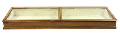 Lot 492 - A glazed oak museum table top display cabinet