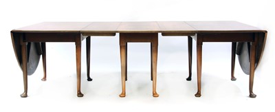 Lot 566 - A mahogany dining table