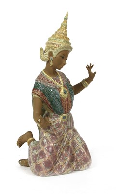 Lot 148 - A Lladro Thai girl kneeling figure