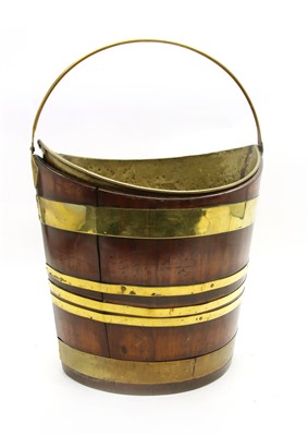 Lot 250 - A mahogany and brass bound bucket