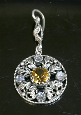 Lot 101 - A silver Arts and Crafts smoky quartz and moonstone pendant, c.1910