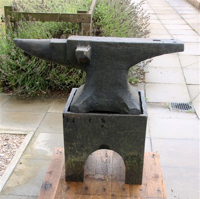 Lot 606 - A large cast iron anvil on separate stand