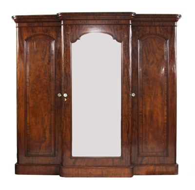 Lot 512 - A mahogany breakfront triple wardrobe