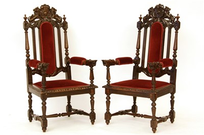 Lot 562 - A pair of late 19th century carved oak throne chairs