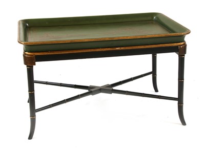 Lot 582 - A green and gilt chinoiserie decorated tray on stand