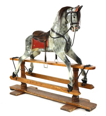 Lot 776 - A dappled grey rocking horse