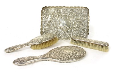 Lot 105 - A silver Art Nouveau four piece dressing table set