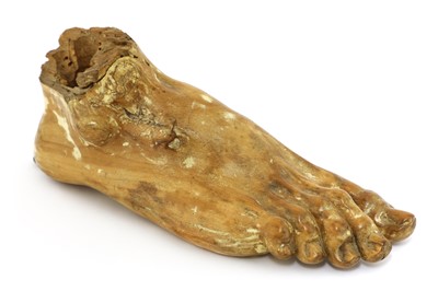 Lot 113 - A carved wood foot