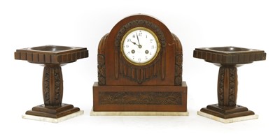 Lot 184 - A French walnut clock garniture