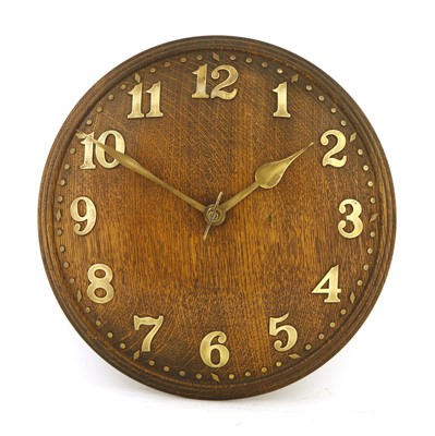 Lot 186 - An Heal's oak convex wall clock