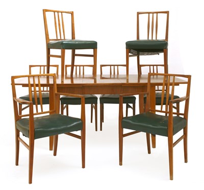 Lot 392 - A Gordon Russell walnut dining suite