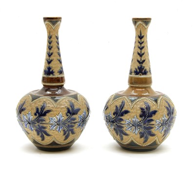 Lot 228 - A pair of Doulton Lambeth glazed stoneware bottle vases