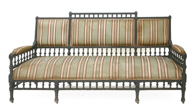 Lot 567 - An Aesthetic ebonised settee