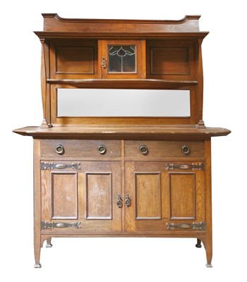 Lot 71 - An oak mirrored back cabinet