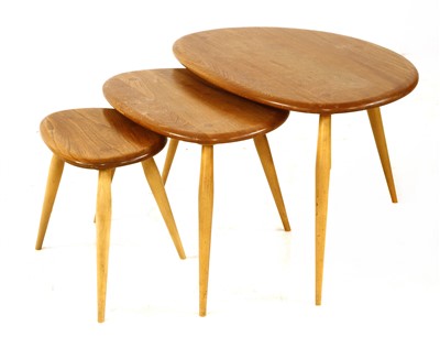 Lot 310 - An Ercol 'Pebble' nest of three tables