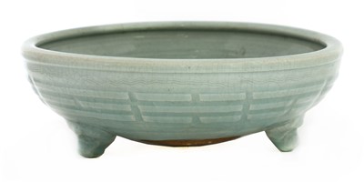 Lot 8 - A Chinese celadon tripod censer