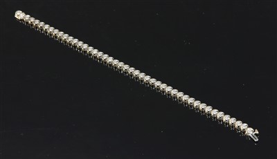 Lot 296 - A 9ct two colour gold diamond set line bracelet