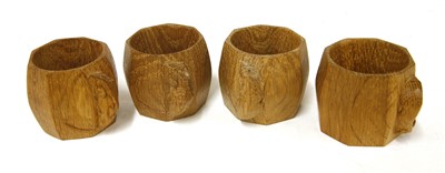 Lot 83 - A set of four Robert 'Mouseman' Thompson oak napkin rings