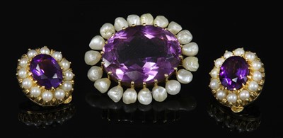 Lot 45 - A late Victorian gold amethyst and pearl oval brooch
