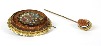 Lot 86 - An oval silver gilt brooch