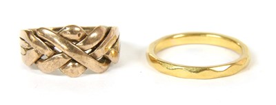 Lot 44 - A four row puzzle ring
