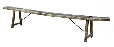Lot 425 - A rustic plank-topped bench