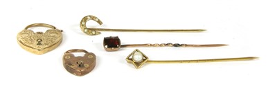 Lot 66 - A flat cut garnet stick pin