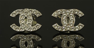 Lot 666 - A pair of Chanel double 'C' clip-on earrings