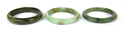 Lot 24 - Three jade bangles