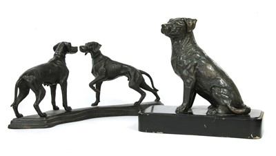Lot 364 - A pair of iron dogs on a stand