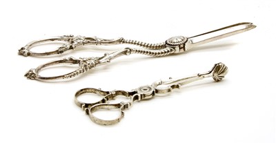 Lot 349 - A pair of white metal sugar nips