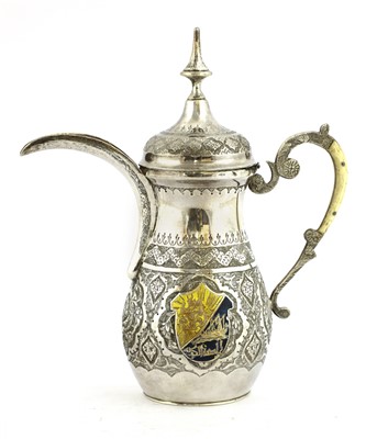 Lot 87 - An Islamic white metal dallah coffee pot