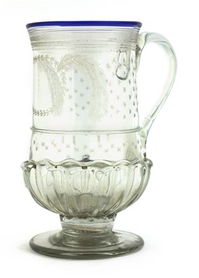 Lot 275 - A glass coin tankard