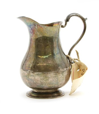 Lot 195 - A George II silver cream jug